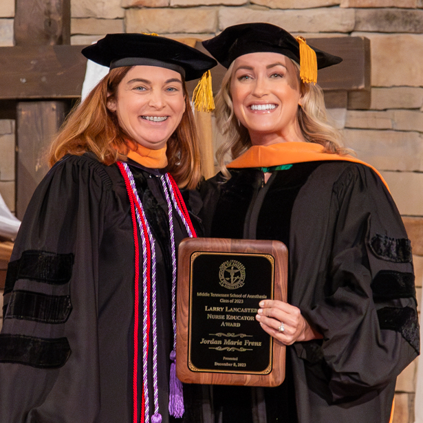 Professor smiling with student who received the Nurse Educator Award